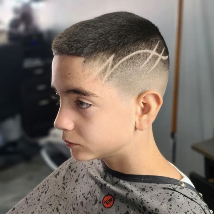 Young client with a skin fade and freehand hair design