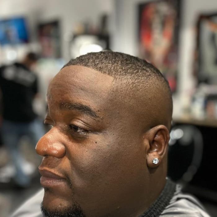 Short cut with a crisp line-up and trimmed beard